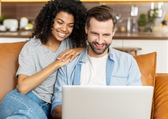 Multiracial couple setting up their retirement plan