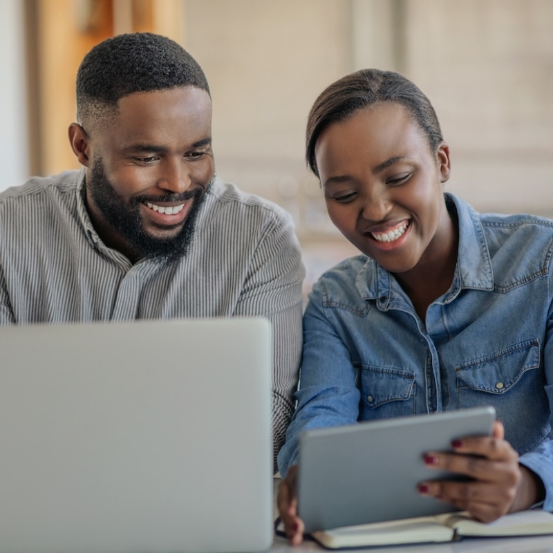 Couple looking at their computer